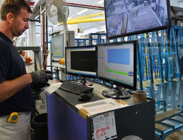 Control station for the processing line, which allows automatic processings at a pass. The identification of the sheet and triggering of production happen via bar code reading, all important information is visualized on the A+W Production Terminal. Via video control, the machine operator has a view of the entire line.