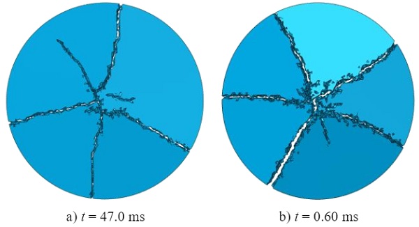 Fig. 14 Glass fragmentation (bottom view) for ring-on-ring test simulation with the immediate element failure model for target piston velocities of a) 10 mm/s, and b) 1000 mm/s.