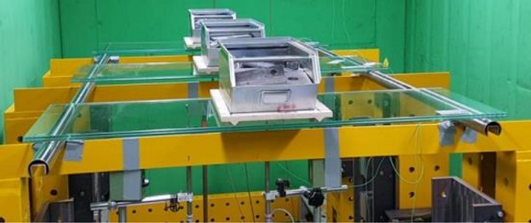 Fig. 2 Four-point bending verification set-up in temperature chamber (picture courtesy of Institute of Structural Engineering, University of the German Armed Forces, München, Germany).
