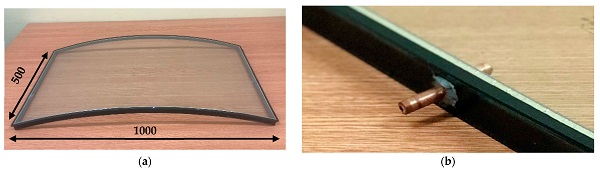 Figure 1. Experimental study: (a) Curved IGU sample; (b) Copper tube glued into a hole drilled in the spacer.