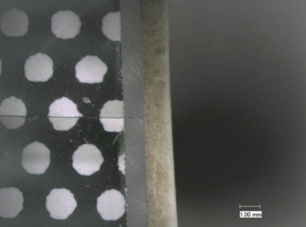 Fig. 8 Close-up of thermal crack originating at frit dot.