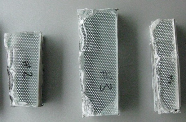 Fig. 9 Samples of cut from failed glass panels.