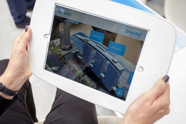 Trosifol™ employee Andrea Schröter demonstrating the augmented reality application for architectural and automotive products