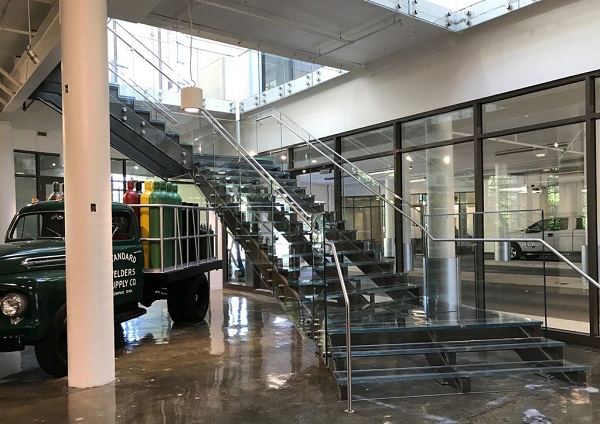 A combined 186 linear feet of Trex Commercial Products’ Point Series, glass treads and risers were used to create a clean, minimalist look for the building lobby