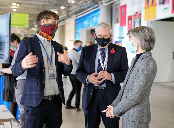 Dame Professor Ottoline Leyser – CEO UKRI speaks to Richard Katz, Chief Executive of Glass Futures & Aston Fuller – General Manager of Glass Futures while visiting the UKRI stand in the Green Zone at United Nations COP26, Glasgow UK on 09 November 2021.