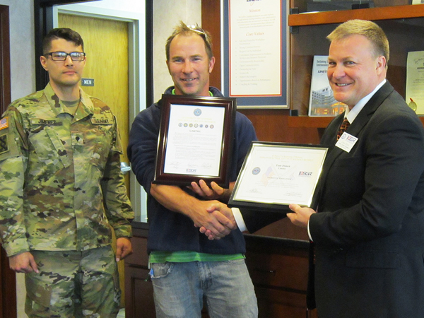 Spc. Andrew Jimenez; Linetec's production supervisor for paint applications, Tom Danen; and ESGR representative, Dave Monk