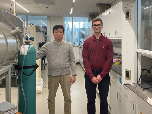 Myungkoo Kang, assistant professor of ceramic engineering in Alfred University’s Inamori School of Engineering (left) and Patrick Lynch, a junior glass science engineering major, in Kang’s lab in the McMahon Engineering Building.