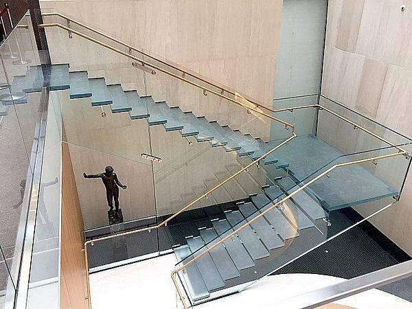 The new, all-glass staircase at the recently renovated Onassis Cultural Center museum is a feat of engineering excellence.