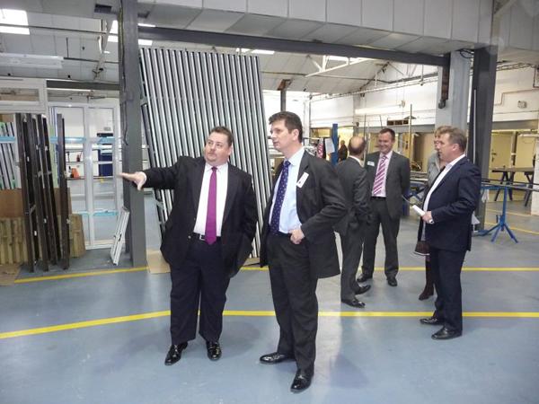 Hazlemere Group Chairman Stuart Braham showing High Wycombe MP Steven Baker Hazlemere Windows Factory