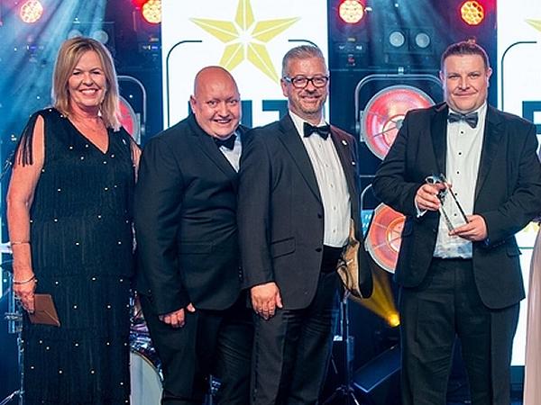 Gareth Jones and Brian McDonald receive the award from Event Director, Nickie West.