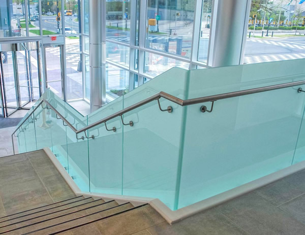The two-story jewel box lobby features both TCP’s Track Rail and Point Series, complementary railing systems that enhance the lightness of the space.