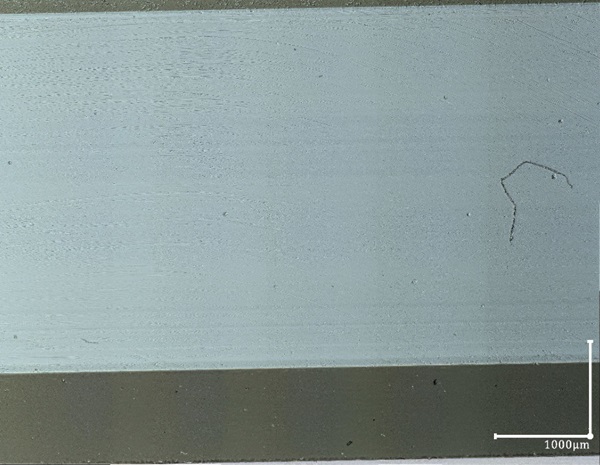 Fig. 12: Polished side surface looked at using transmitted light, composed X,Y,Z 2D photo , 200X, surface defects better visible.