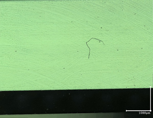 Fig. 13: Polished side surface looked at using reflected light, composed 2D photo , 200X, polishing marks better visible.