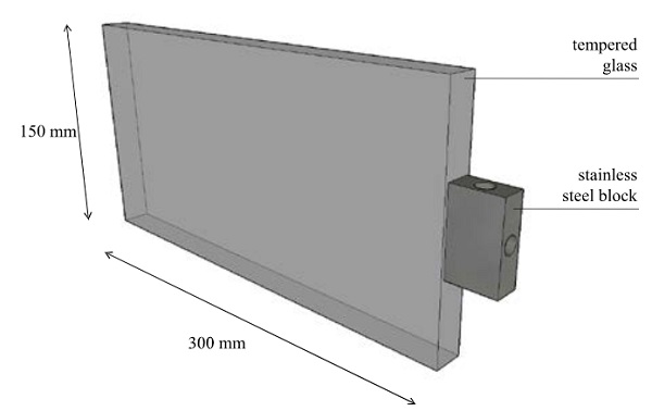 Fig. 1 Glass specimen with stainless steel block bonded to the edge