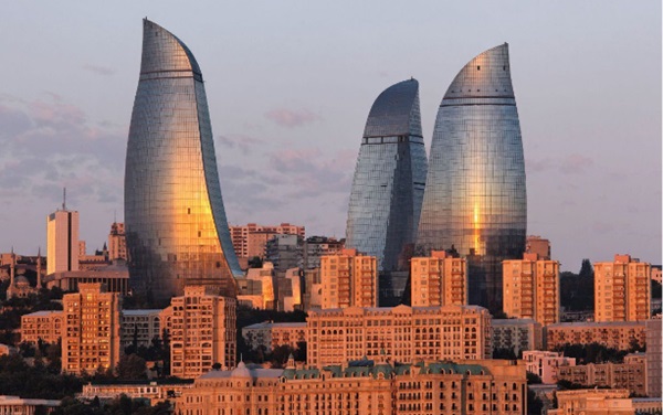 Fig. 1:   The Flame Towers in Baku, in the background of more traditional developments: a typical example of a contemporary SSG unitised façade.