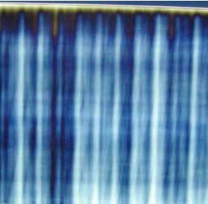 Figure 2. Anisotropy pattern of tempered glass produced by moving it in quenching seen through polarized filters.