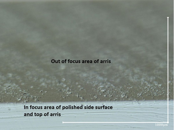 Fig. 3: Photo of edge of arris, magnification 200X, transmitted lighting.
