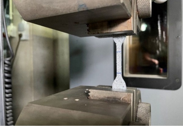 Fig. 3: Dumbbell gripped in UTM.