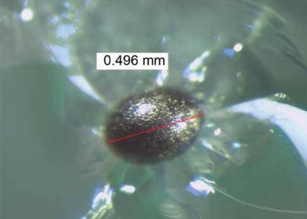 Figure 3. Spectrographic view of nickel sulfide inclusion. Note: 1 in. = 25.4 mm. 