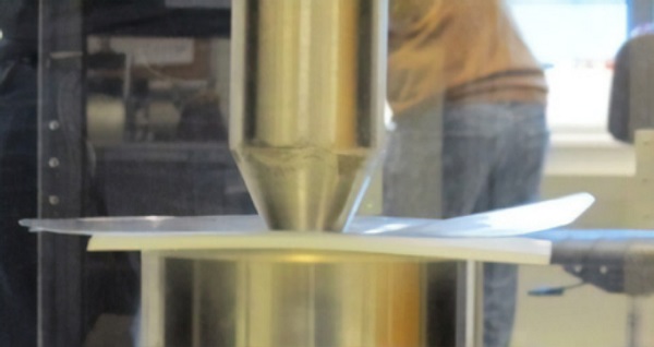 Figure 3: Large deformations in 0.5 mm Falcon glass during coaxial double ring test.