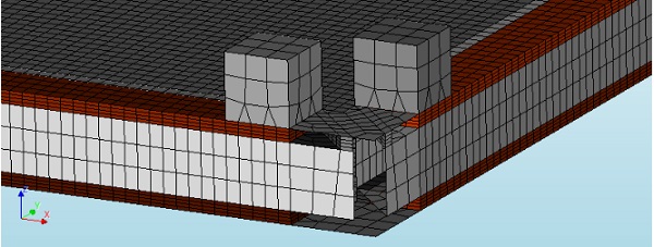 Fig. 4: Mesh detail of the finite element model.In the image, a corner of the panel is shown. The loading blocks are visible on top. The silicone joints, modelled with solid brick elements, are shown in orange. The glass and the frame are modelled as 2D shells.