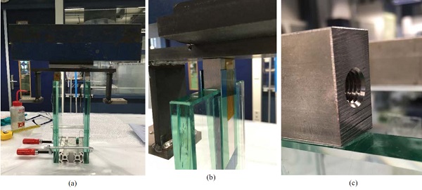 Fig.5Sample fabrication: (a)arrangement for the application of pressureto the connectors, (b) aluminium plates for stability and alignment of the connector, (c) close view to the connection after lamination