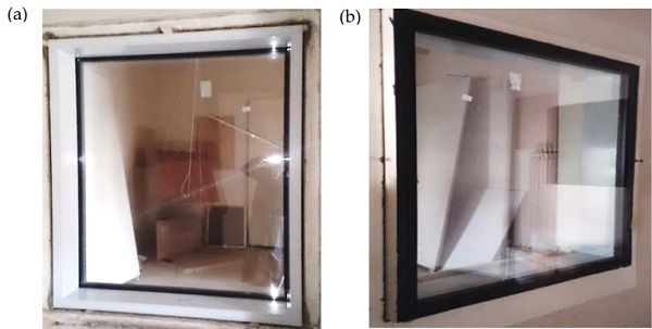 Figure 5. Test specimen installed in an opening of separating wall. (a) View from receiving room side; (b) view from source room side.