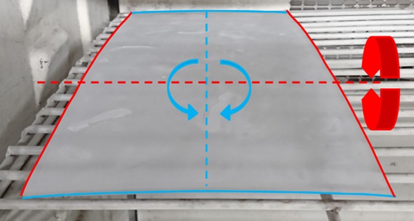 Figure 5: 200x400 mm² sample in climate change test at -40°C. Bending along both axes can be seen.
