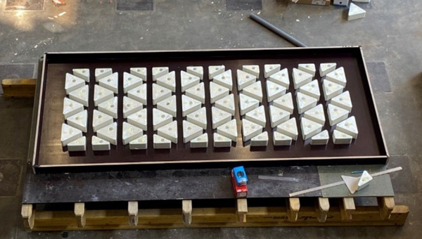 Fig. 5: Formwork for the hybrid panel with XPS triangles.