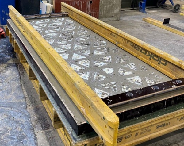 Fig. 6: Concrete casting for the hybrid panel, with additional recesses created using fixed elements on a beam.