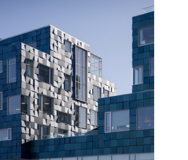 Figure 7. Copenhagen International School Nordhavn (Denmark), ar chitect C.F. Møller. The façade is covered in 12,000 PV each individual panels, ly angled to give the façade its effect. They supply over 50% of the school´s annual electricity consumption. Photo: Adam Mørk