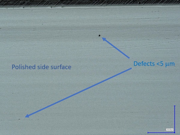 Fig. 7: Polished edge of a glass specimen, with small defect, magnification 500x, transmitted lighting.