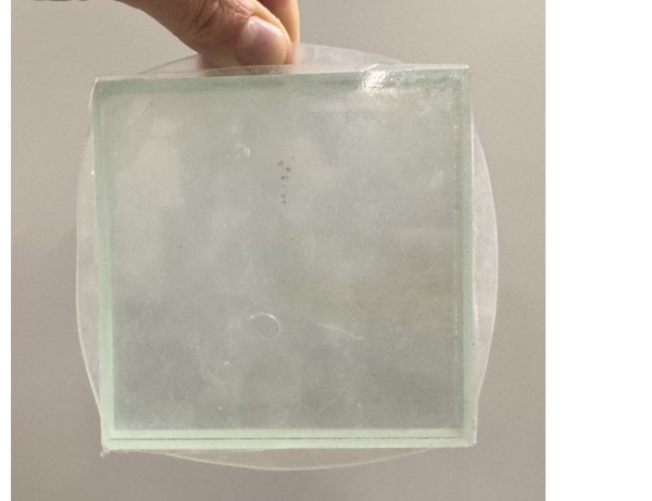 Fig. 7: Compressed sample showing significant squeeze out and adhesion.