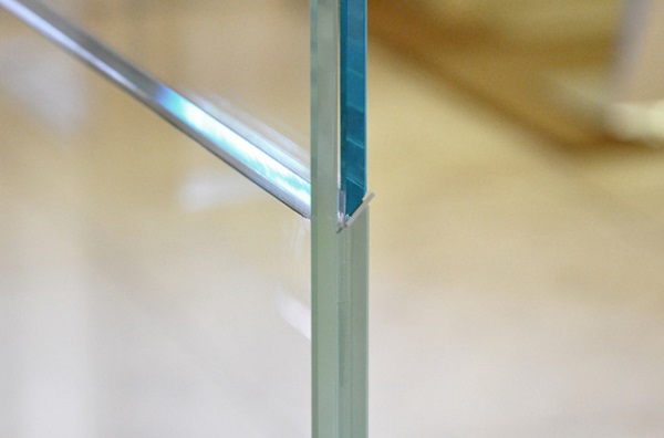 Fig. 8: Glass-dovetail connection with thin acrylic sheets preventing edge-to-edge contact and allowing gliding during assembly