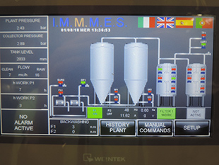 The main control cabinet, and a view of the main operating screen