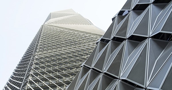 Capital Market Authority Headquarters, Riyadh. The building envelope consists of insulated glazing overlaid with fins, catwalks, and perforated panels for shading and maintenance functions. Photo © Hani Al-Sayed / Omrania