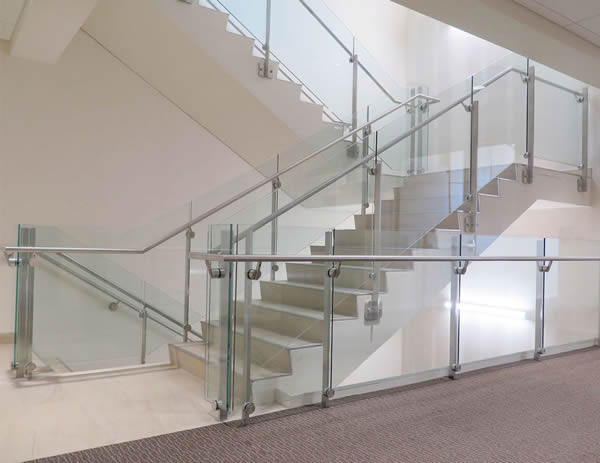 Fascia mounted Dot series railing ascends multiple level parking garage entrances