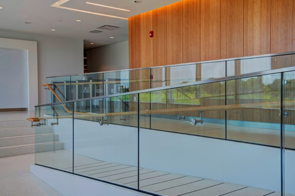 Track Rail is attached through bolts to steel angles at overlooks and seamlessly blends into the minimalistic design of the office space