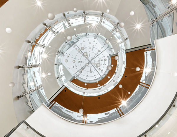 Glass railing on spiral staircase at Colorado State University Health and Medical Center