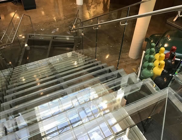 Glass treads and risers were attached using three-inch-wide, clear VHB tape, adding to the illusion of invisibility.