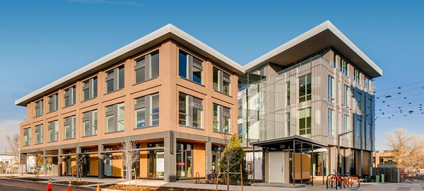 Boulder Commons, a net zero energy development in Colorado, is the home of Rocky Mountain Institute’s Boulder office. The project sets a new paradigm for zero energy lease structures, alternative mobility and high-performance speculative buildings. Alpen fiberglass windows provide a critical element of these two 100,000 square foot NZE/ZE buildings.     Zero energy buildings have recently experienced a boom in popularity. But despite industry progress, the number of leased ZE buildings lags significantly behind owner-occupied projects. Over half of commercial buildings nationally are leased, which presents a significant impediment to meeting carbon reduction targets. Boulder Commons boasts Colorado’s first NZE lease, and the first NZE lease in the country for a project of this size, setting a new precedent for other landlords and tenants to follow.     Boulder Commons is demonstrating the unique values driven by net-zero carbon buildings and districts to drive competitive advantage, while providing a mechanism to economically support the global transition to clean, renewable energy.  Goals of sustainability and construction technologies Alpen worked closely with the developers, designers and energy consults to assure the comfort, cost, energy consumption and net-zero certification goals were achieved. In order to make the building highly sustainable, a number of strategies were designed into the project from the outset.     In addition to the solar array tuned to the building’s aspect on the site, the project sought to reduce its demand loads on an annualized basis. The two buildings provide optimum widths for daylighting. Designing the building’s east side to “erode away” provided opportunities for internal residential and commercial plazas, reducing the need for artificial light. A responsive HVAC strategy allows the building to respond to the actual unit needs rather than conditioning on a full-building scale, and a variety of unit and tenant-based ides were considered to reduce plug loads.  BC-4 How Alpen pro