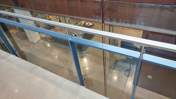 Floor mounted Post Rail with stainless steel bar posts and rail frames are used on the staircase and overlooks.