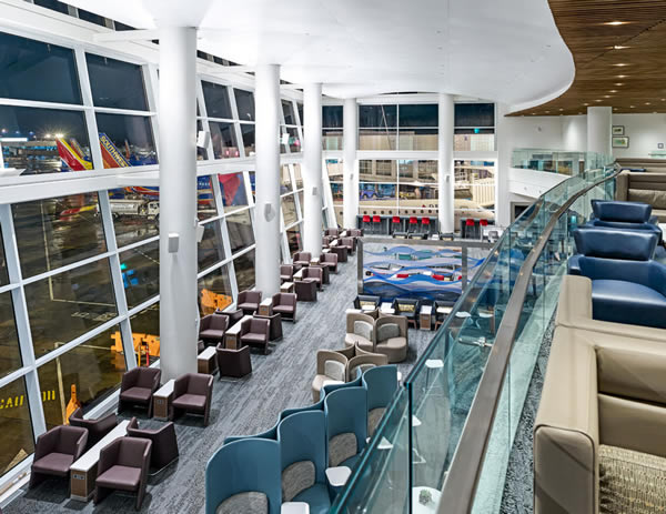 Transparent railing panels afford unobstructed views of the massive space, allowing travelers to scope out the ideal spot to relax or work – or simply enjoy the view.