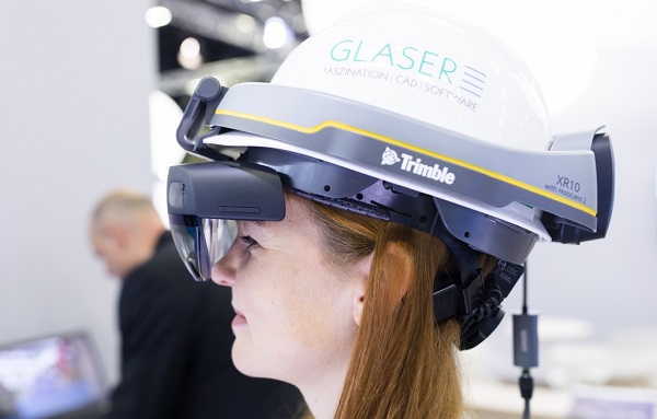 Digital solutions, such as the mixed reality construction helmet shown here, are changing the way people work on construction sites.