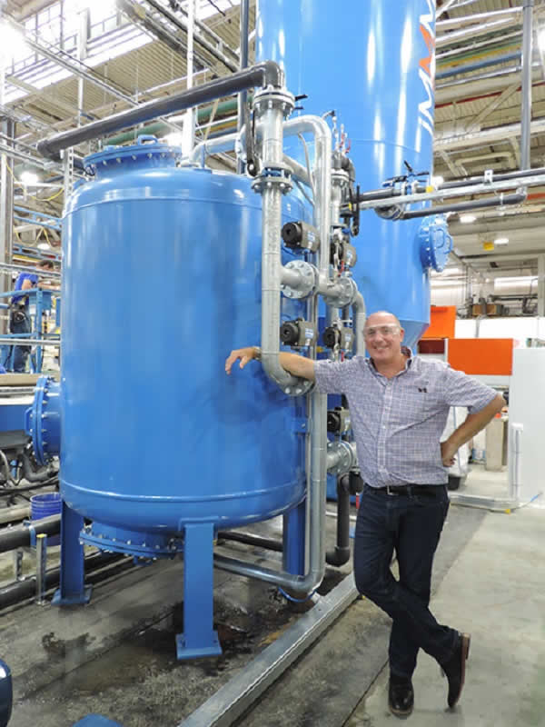 Max Williams by the final filtration unit, which produces water under 10 microns, clean enough for any CNC machine!