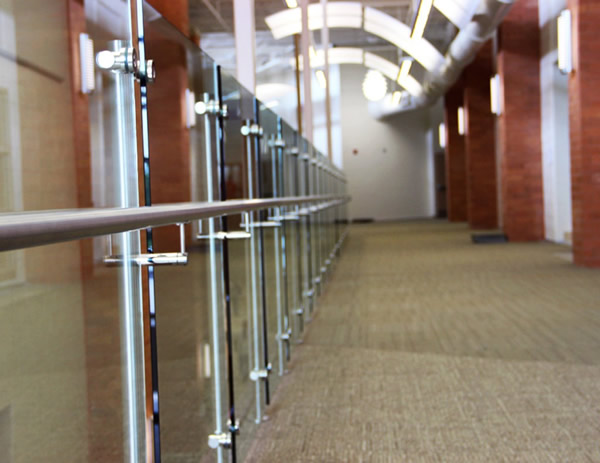 Long runs of Equinox railing create separation with a dramatic, yet minimal aesthetic