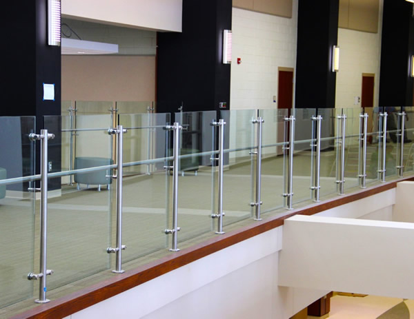Top-mounted Equinox glass railing ith diskand-rod glass mounts