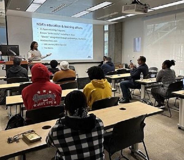 NGA's Alicia Hamilton (standing) speaks with Prairie View A&M students