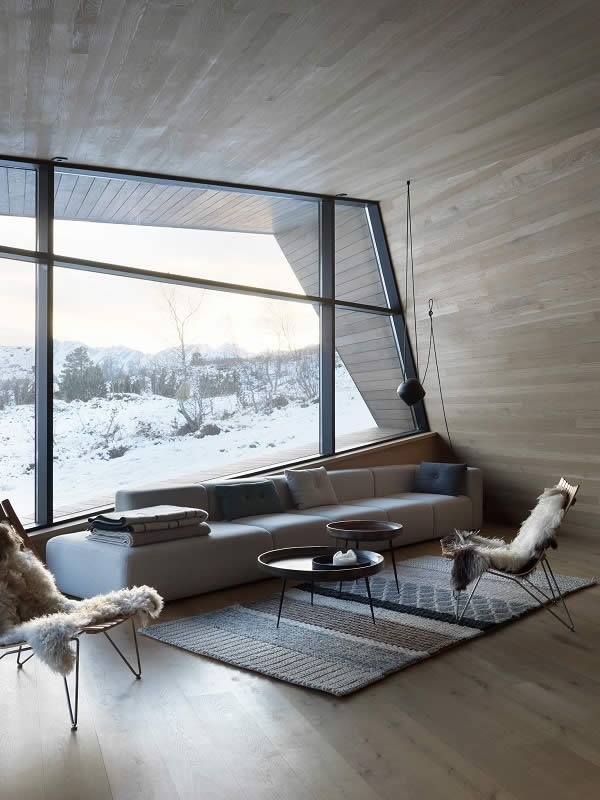 Photo Credits: Invit Arkitekter, Ålesund // Photographer: Johan Holmquist Highest insulation capacities of the Schüco façade and door systems allow for transparency amids the cold region of Norway (Schüco FW 50+.SI).