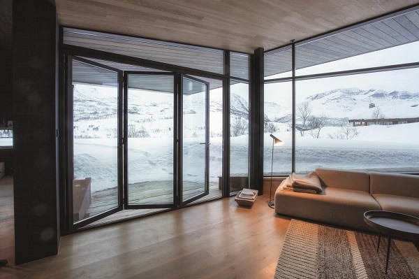 Photo Credits: Invit Arkitekter, Ålesund // Photographer: Johan Holmquist Highest insulation capacities of the Schüco façade and door systems allow for transparency amids the cold region of Norway (Schüco FW 50+.SI).